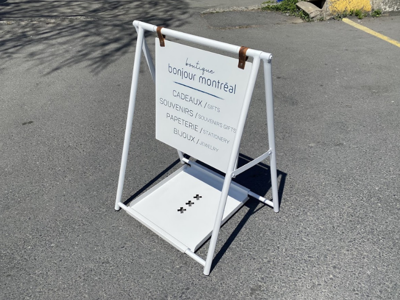 Two-sided A-frame sidewalk sign with a tray, designed for effective outdoor advertising. The tray provides extra space for materials, making it perfect for cafes, restaurants, and small businesses. Referred to as a ‘small business sign’ and ‘cafe sign,’ it increases your visibility.

