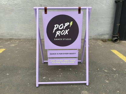 Portable double-sided A-frame sidewalk sign stands out in the outdoor space or entrance of your business. This sign, which can be used printed or blank, is ideal for displaying menus, promotions, or daily announcements. Known as a ‘sidewalk sandwich sign’ and ‘storefront A-frame sign.’